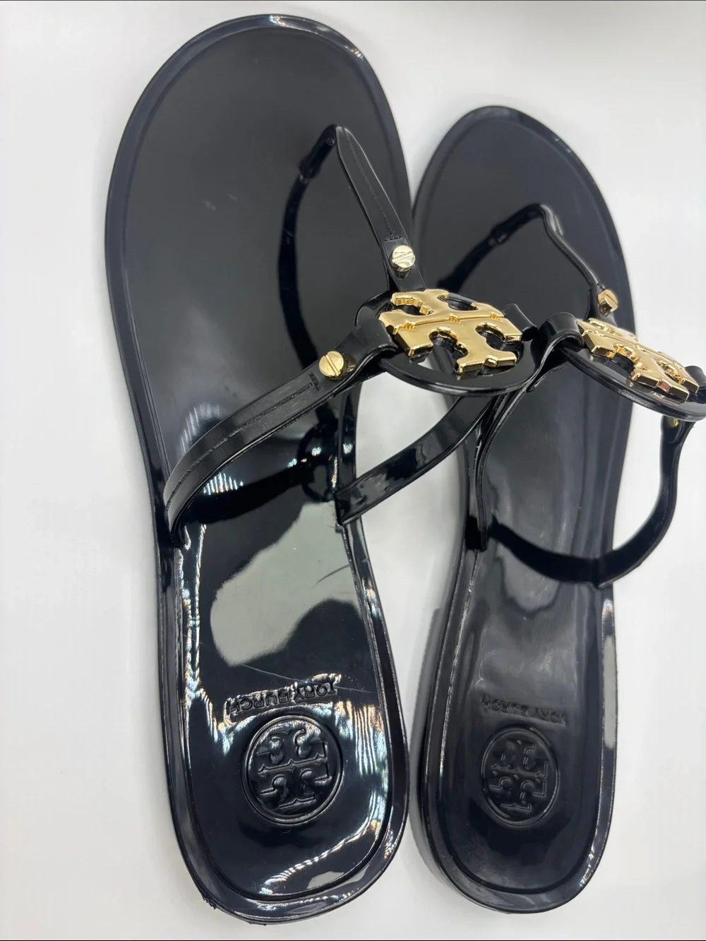 Tory Burch Black Jelly Thong Sandals with Gold Logo Medallions